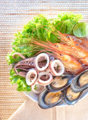 Seafood food in white bowl, shrimp, squid, shellfish