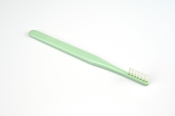 One row of green brushes for teeth