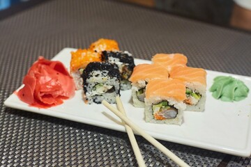 Assorted rolls on a plate. Several types of Japanese food from fish, vegetables and algae