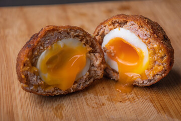 Homemade English Scotch Eggs Wrapped in Sausage close up 