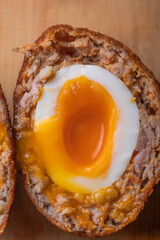Homemade English Scotch Eggs Wrapped in Sausage close up 