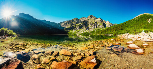 Tatra National Park in Poland. Famous mountains lake Morskie oko or sea eye lake In High Tatras. Five lakes valley. Banner, panorama © Zedspider