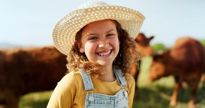 Happy little girl, portrait smile and farm with animals enjoying travel and nature in the countryside. Child smiling in happiness for agriculture, life and sustainability in farming and cattle