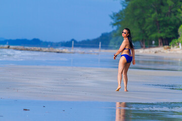 Woman body big walk happy with swimsuit in morning