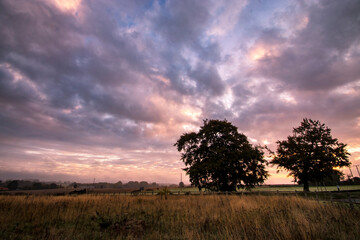 Fototapeta premium A dramatic early morning sky in a rural part of Suffolk, UK