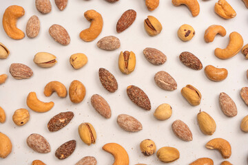  A group of almonds, pistachios, walnuts, macadamia, cashews.