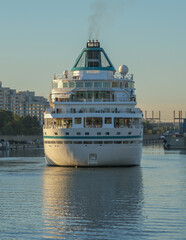 Phoenix cruiseship or cruise ship liner Amera in port of Montreal, Canada on sunny day on St. Lawrence River for Indian summer East Coast cruising with downtown skyline and terminal