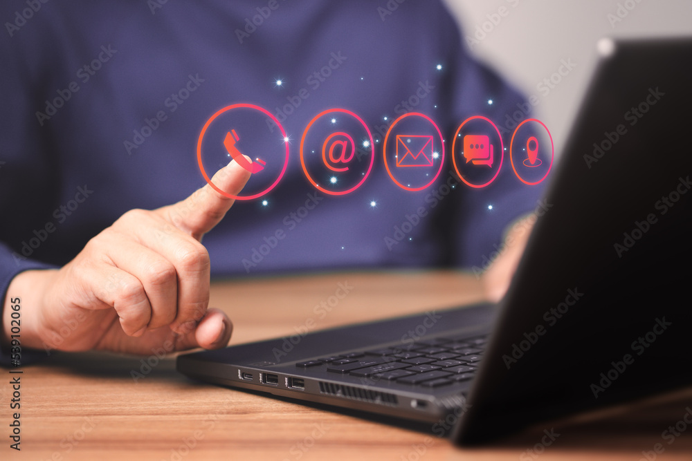 Poster Man using a computer laptop and touching on technology virtual screen contact icons ( phone, email, address, live chat, map ). Contact us or Customer support hotline people connect.