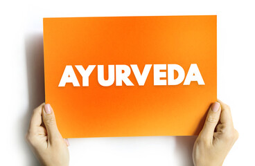 Ayurveda - alternative medicine system with historical roots in the Indian subcontinent, text concept on card