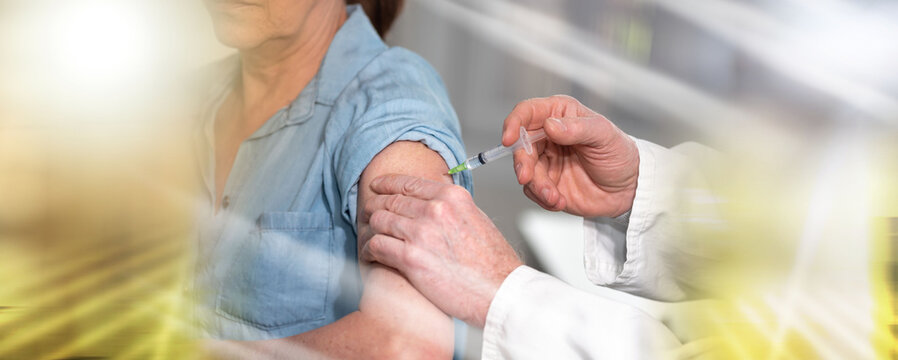 Doctor giving vaccin injection to patient; multiple exposure