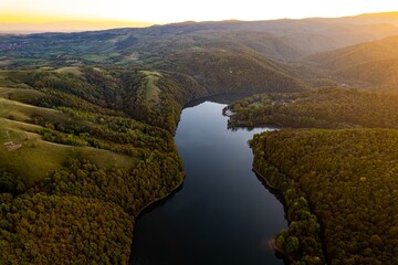 Colorful aerial view of Secu Lake in Caras-Severin - Romania, in the autumn, at sunrise. Scene...