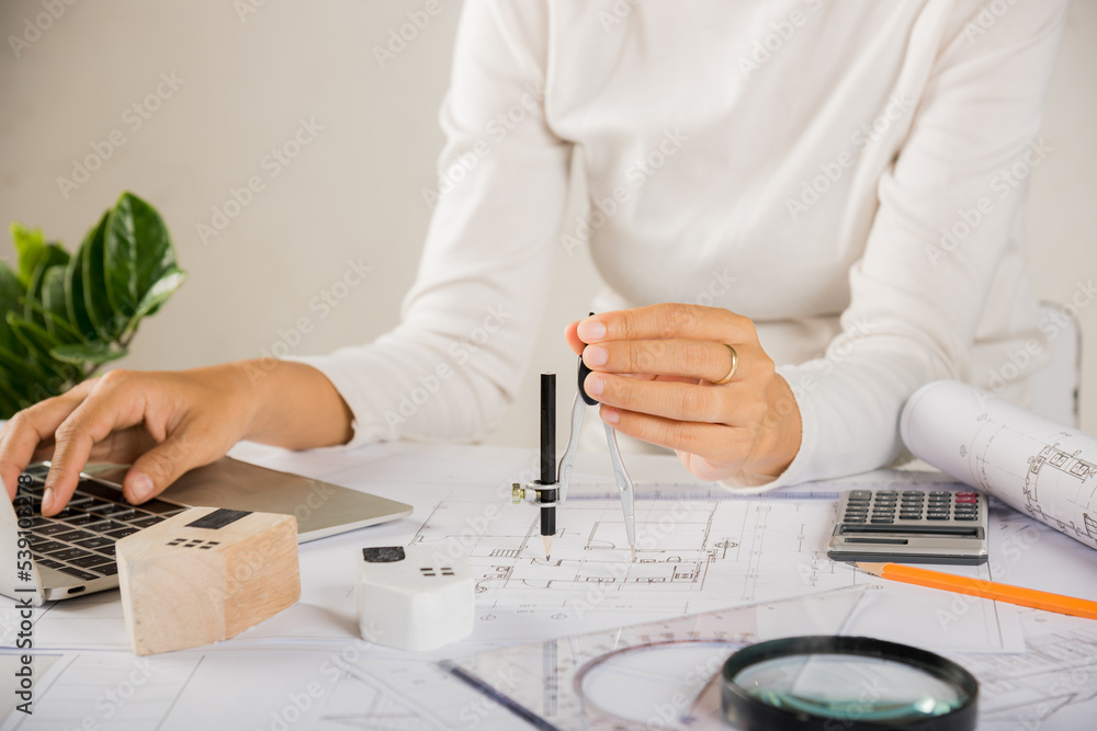 Poster architectural project workplace. architect typing laptop keyboard to review design of house before e
