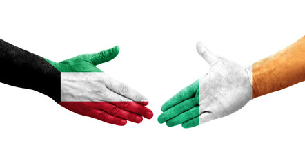 Handshake between Ireland and Kuwait flags painted on hands, isolated transparent image.