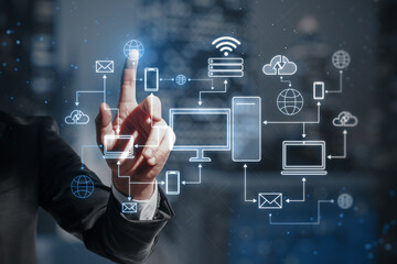 man hand pointing at creative glowing computer cloud network hologram on blurry city background. Business and technology concept. Smart office. GUI (Graphical User Interface). Double exposure.