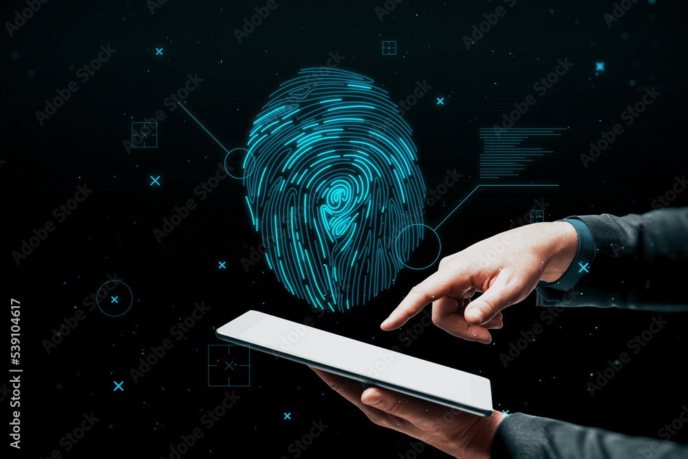 Poster close up of businessman hand pointing at tablet with abstract glowing finger print id hologram on da