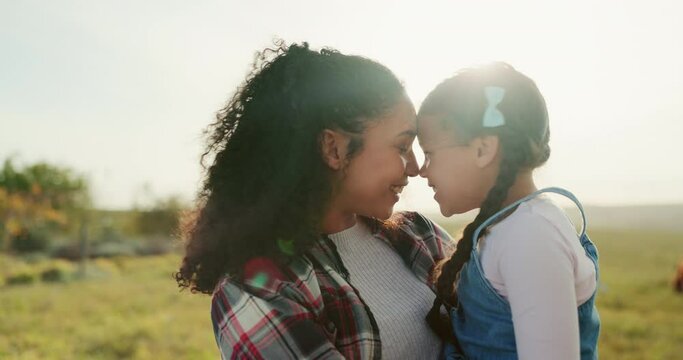 Love, cows and woman holding child with smile in field at sustainable animal farm in summer. Happiness, sustainability and farming, happy mother and daughter standing on farm with grass and livestock