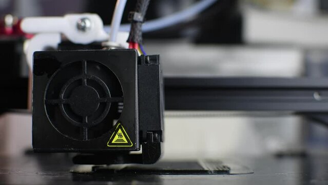 The 3D printer prints the model out of black plastic. Modern techology. 4K