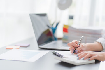 Close up of Business team analyzing income charts and graphs with modern laptop computer. Business analysis and strategy concept.
