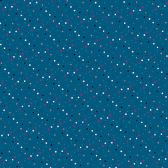 Geometric print of white, black, red, blue and orange polka dots isolated on a dark muted blue background