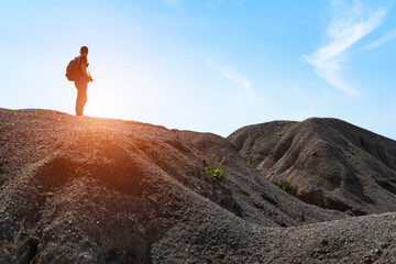 Black silhouette of hiker man backpacker with backpack to climbing and walking to see view of the Grand Canyon  Ratchaburi on sunrise.Adventure active vacations outdoor mountaineering sport travel.