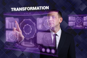 Business, Technology, Internet and network concept. Young businessman working on a virtual screen of the future and sees the inscription: Transformation