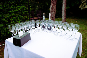 many wedding glasses with sparkling wine in restaurant