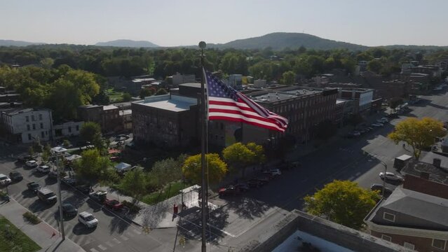 flying clockwise around American flag in downtown Newburgh New York