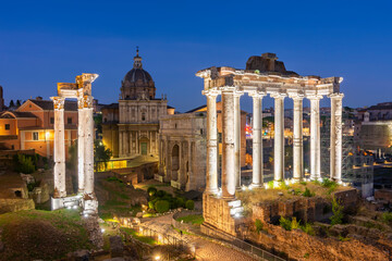 Fototapeta na wymiar Ruins of Roman Forum at night, Rome, Italy