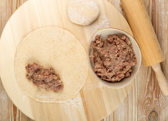 Making Flat Bread with Filling of Ground Meat and Onions, Cooking Stuffed Chebureki © ange1011
