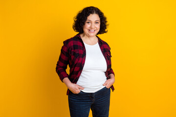 Middle age beautiful businesswoman standing over isolated yellow background with happy cool smile lucky person