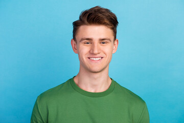 Happiness. Portrait of young man in casual cloth isolated over blue background feelings youth fashion