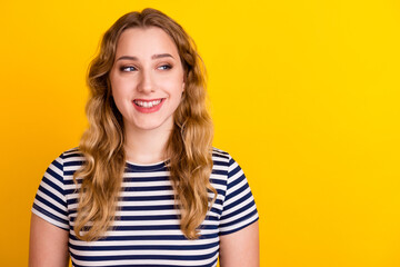 Portrait of beautiful young woman smiling cheerfully showing white teeth feeling happy look on yellow background