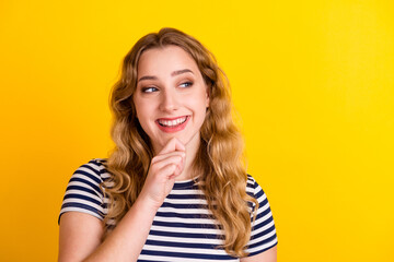 Photo of short hairdo lady looking up empty space deep thinking creative person isolated yellow color background