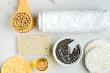 Cosmetic clay. clay facial mask on a light background. spa accessories. natural cosmetics for...
