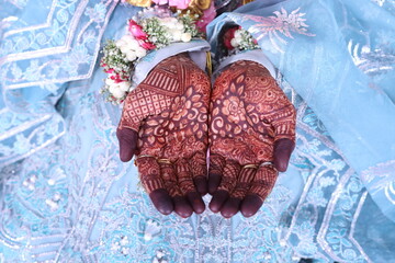 bride showing mehndi in hands