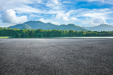 Asphalt road and green forest with mountain nature landscape in Hangzhou, China.