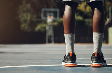 Fototapeta na wymiar Basketball, sneakers and athlete black man standing on community sports court for match, motivation and streetball memory. Male player outside in USA with sport shoes on feet for fitness and exercise