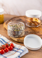 A set of transparent cans for dry food on a light background
