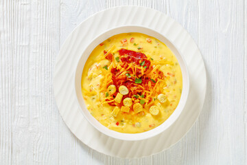 savory creamy pumpkin soup in bowl, top view