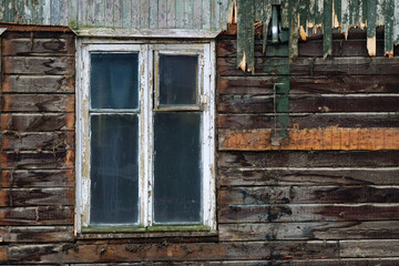 Fototapeta na wymiar Old window of an old ruined house