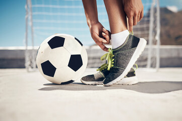 Fitness, football and feet with sport shoes standing with ball for a soccer game in summer ready to...