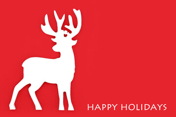 Christmas eve reindeer happy holidays north pole festive design on red background. Fun symbol for winter Xmas and New Year holiday season.