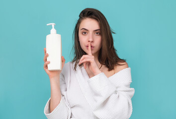 Health hair and beauty concept. Woman hold bottle shampoo and conditioner.