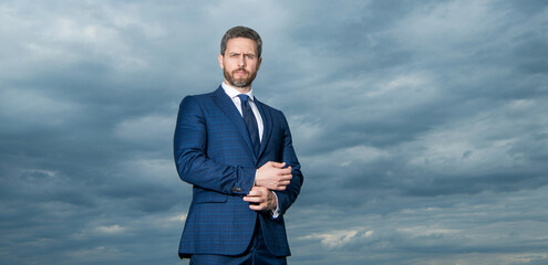 Professional man sky background. Grizzled man in suit. Serious man outdoors, copy space