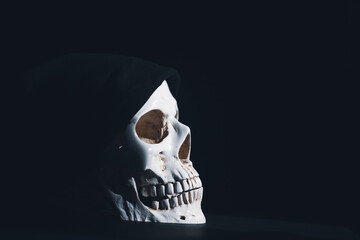 Human skull on a black background.