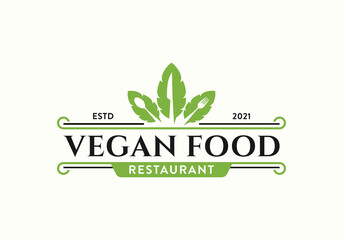 Fresh vegetable leaf with spoon, fork, knife. Vintage vegan restaurant bar bistro logo design template