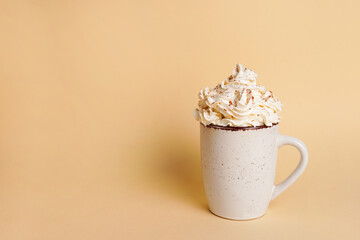 Coffee. fluffy creamy whipped trend drink with coffee foam and milk. white cup with latte on yellow...