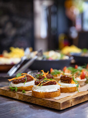Banquet table served for holiday with canape and different snacks. European food. Catering.