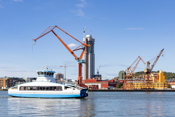 Cranes in Gothenburg harbor with traffic and activity,Sweden,Europe