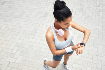 Exercise, runner and black woman with digital smartwatch to track steps, calories counter or heart...